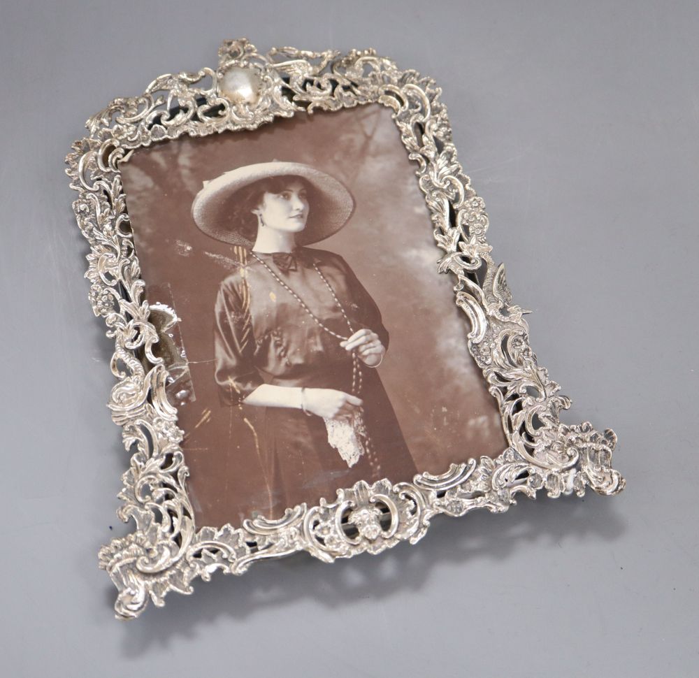 A late Victorian pierced silver photograph frame, by Goldsmiths & Silversmiths Co Ltd, London, 1894, 19.1cm.